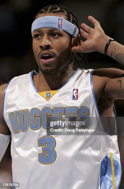 Allen Iverson of the Denver Nuggets encourages the crowd as the Nuggets defeated the Boston Celtics 116-105 during a NBA Game at the Pepsi Center...