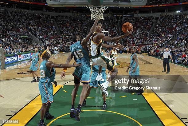 Mikael Gelabale of the Seattle SuperSonics goes up against Rasual Butler of the New Orleans/Oklahoma City Hornets at the Palace of Auburn Hills...