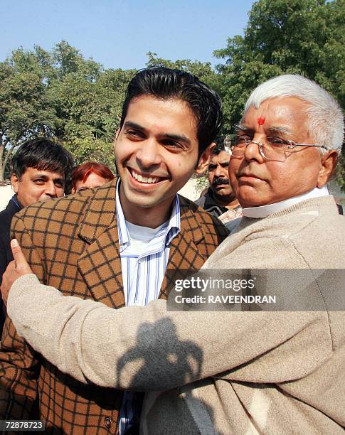 Indian Railway Minister Lalu Prasad Yadav greets Pakistani student, Asim, of the Harvard and Wharton Business School at the National Rail Museum in...
