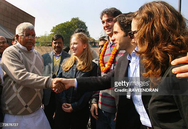 Indian Railway Minister Lalu Prasad Yadav greets students of the Harvard and Wharton Business School at the National Rail Museum in New Delhi, 27...