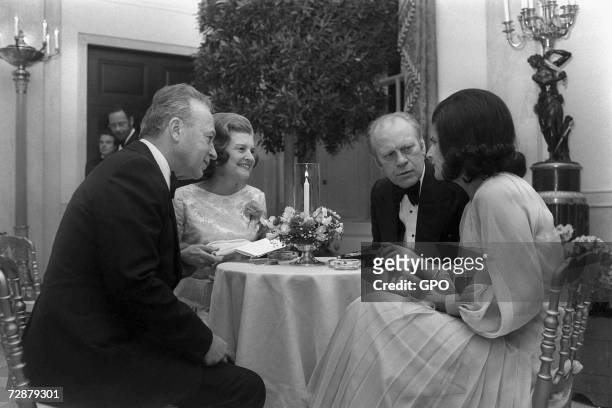 In this photo provided by the Israeli Government Press Office U.S. President Gerald Ford and his wife Betty Ford have dinner with Israeli Prime...