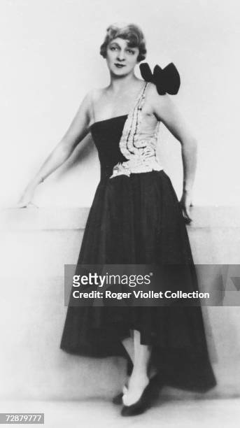 Fashion model wears a dress designed by French fashion designer Jeanne Lanvin, Paris, early 20th Century.