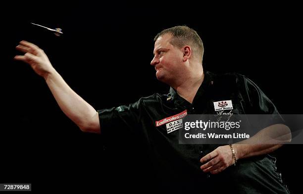 Andy Jenkins of England throws against Andy Smith of England during the second round of The Ladbrokes World Darts Championship at The Circus Tavern,...