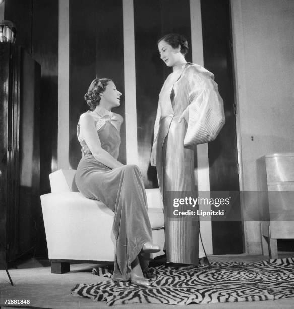 Fashion models wear evening gowns designed by French fashion designer Jeanne Lanvin, Paris, September 1934.