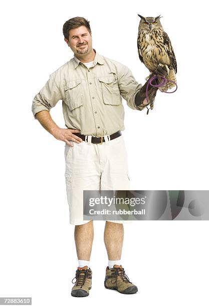 animal handler with owl - zoo keeper stock pictures, royalty-free photos & images