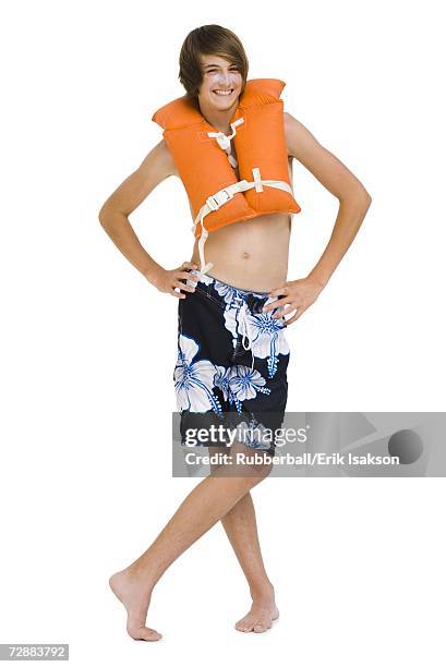 boy in swim trunks with life vest - life jacket isolated stock pictures, royalty-free photos & images