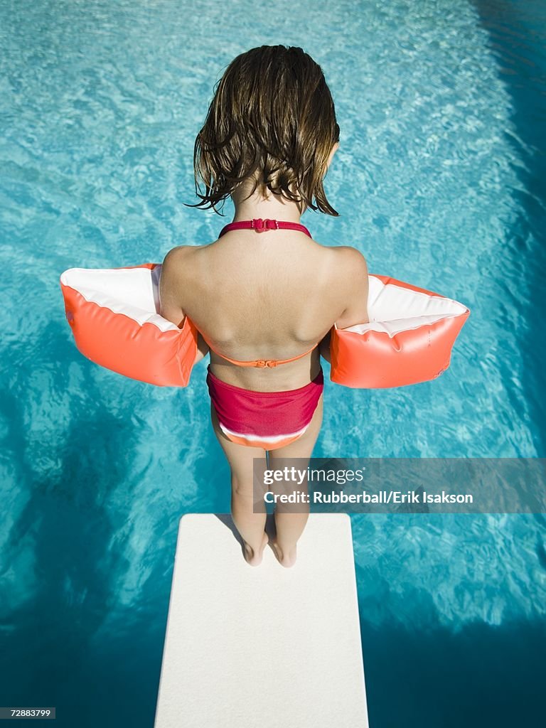 Girl diving into swimming pool