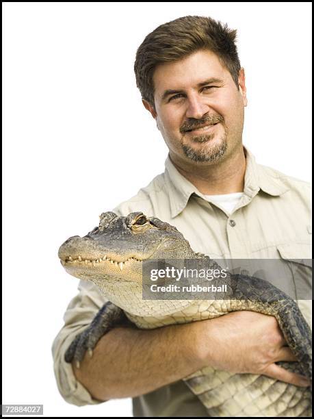 animal handler with alligator - zoo keeper stock pictures, royalty-free photos & images