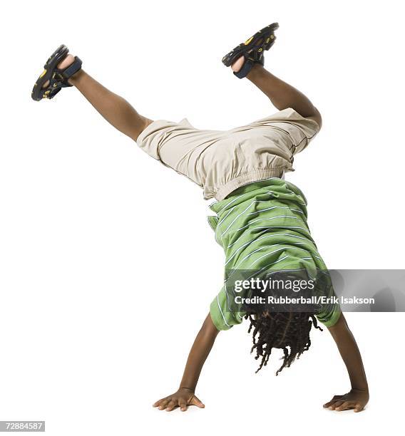 boy doing a cartwheel - cartwheel stock pictures, royalty-free photos & images