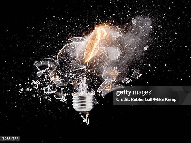 exploding light bulb - exploding lightbulb stock pictures, royalty-free photos & images
