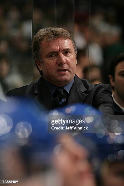 Assistant coach Rick Bowness of the Vancouver Canucks looks on against the Minnesota Wild at General Motors Place on December 16, 2006 in Vancouver,...