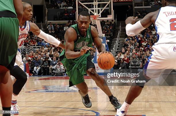 Tony Allen of the Boston Celtics drives to the hoop against Cuttino Mobley and Tim Thomas of the Los Angeles Clippers on December 27, 2006 at Staples...