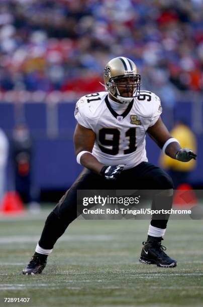 Defensive End Will Smith of the New Orleans Saints rushes the passer against the New York Giants on December 24, 2006 at Giants Stadium in East...