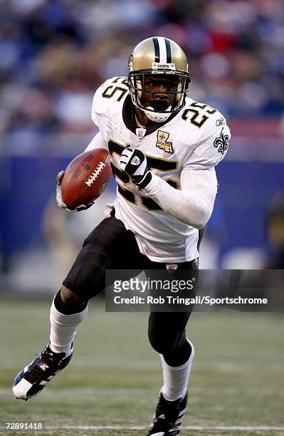Running Back Reggie Bush of the New Orleans Saints runs with the ball against the New York Giants on December 24, 2006 at Giants Stadium in East...