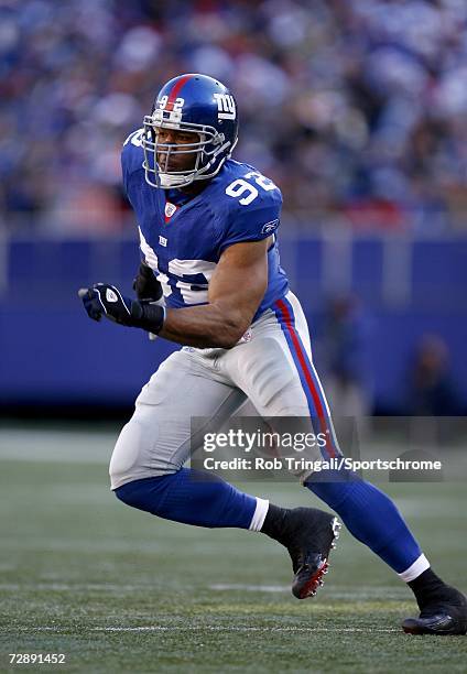 Defensive End Michael Strahan of the New York Giants rushes the passer against the New Orleans Saints on December 24, 2006 at Giants Stadium in East...