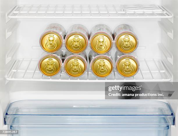 beer cans in fridge (close-up) - beer fridge stock-fotos und bilder