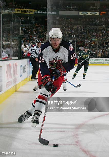 Dan Fritsche of the Columbus Blue Jackets skates with the puck against the Dallas Stars at American Airlines Center on December 12, 2006 in Dallas,...