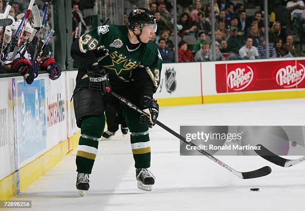 Jussi Jokinen of the Dallas Stars handles the puck against the Columbus Blue Jackets at American Airlines Center on December 12, 2006 in Dallas,...