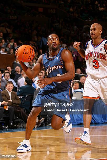 Gilbert Arenas of the Washington Wizards drives past Stephon Marbury of the New York Knicks on December 6, 2006 at Madison Square Garden in New York,...