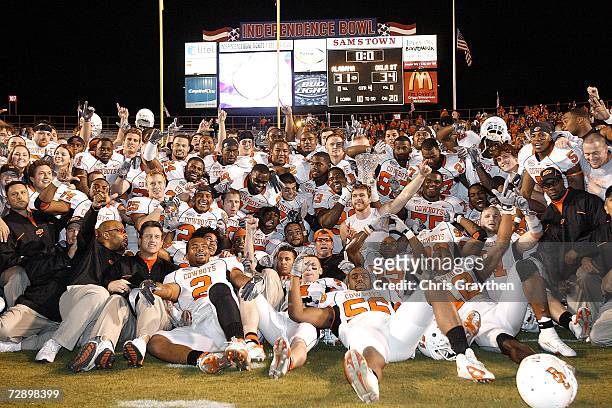 The Oklahoma State football team celebrate their win over Alabama on December 28, 2006 during the PetroSun Independence Bowl at Independence Stadium...