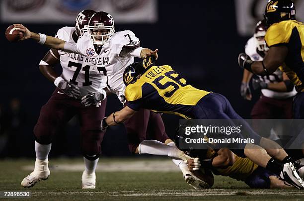 Quarterback Stephen McGee of the Texas A&M Aggies is tackled by Zack Follett the California Golden Bears during the 1st half of the Pacific Life...