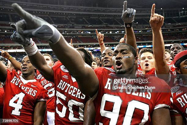 Defensive end Jamaal Westerman of the Rutgers Scarlet Knights celebrates with teammates after the game against the Kansas State Wildcats in the Texas...