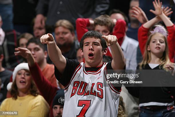 Chicago Bulls fans cheers during a game against the Milwaukee Bucks at the United Center on December 15, 2006 in Chicago, Illinois. The Bulls won...