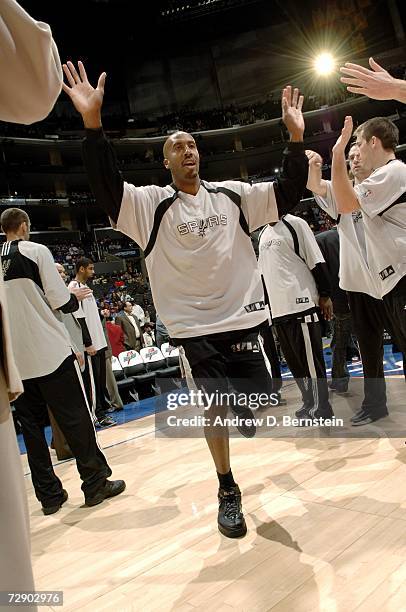 Bruce Bowen of the San Antonio Spurs high fives teammates during player introductions prior to the game against the Los Angeles Clippers on December...