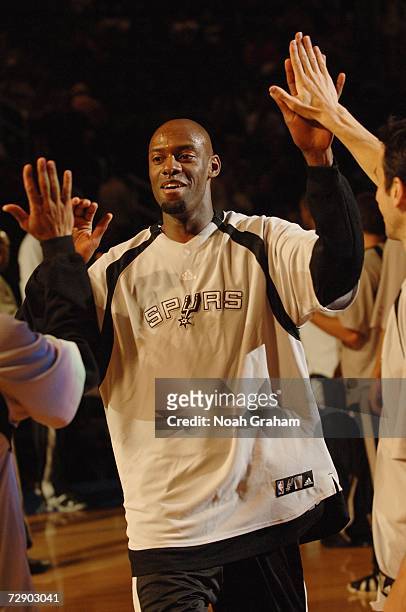 Francisco Elson of the San Antonio Spurs high fives teammates during player introductions prior to the game against the Los Angeles Clippers on...