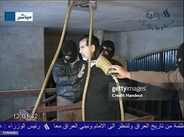 In this television screen grab taken from Iraqi national television station Al-iraqia, a video shows the moments leading up to the execution of...