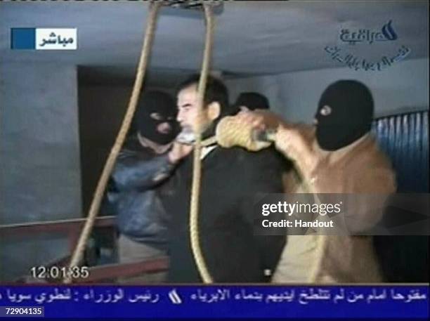 In this television screen grab taken from Iraqi national television station Al-iraqia, a video shows the moments leading up to the execution of...