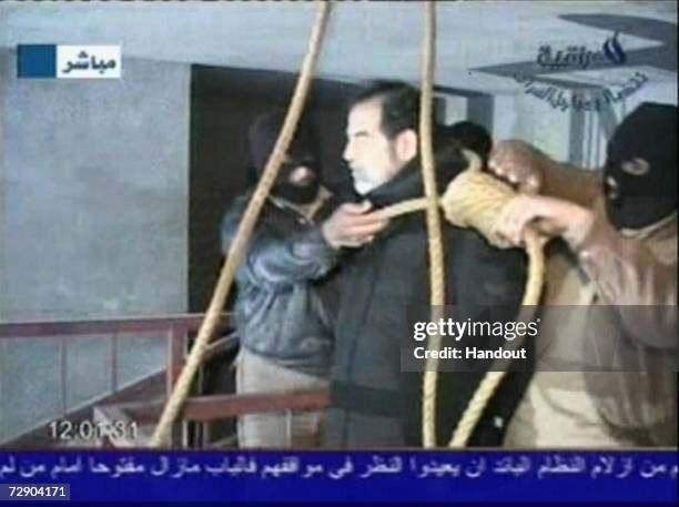 In this television screen grab taken from Iraqi national television station Al-iraqia, a video shows the moments leading up to the execution of...