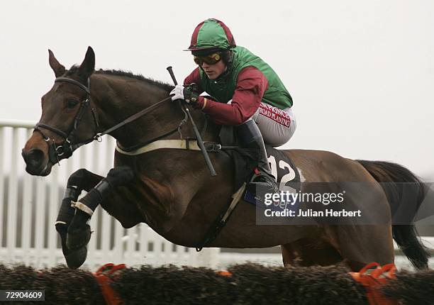 Up At Midnight and Paddy Merrigan in action during The Press Red To Bet On ATR Handicap Hurdle Race run at Ascot Racecourse on December 30 in Ascot,...
