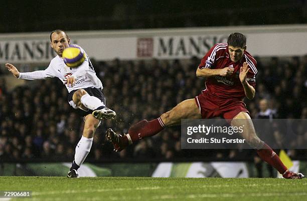 Danny Murphy of Tottenham attempts a shot on goal as Steven Gerrard of Liverpool closes in during the Barclays Premiership match between Tottenham...