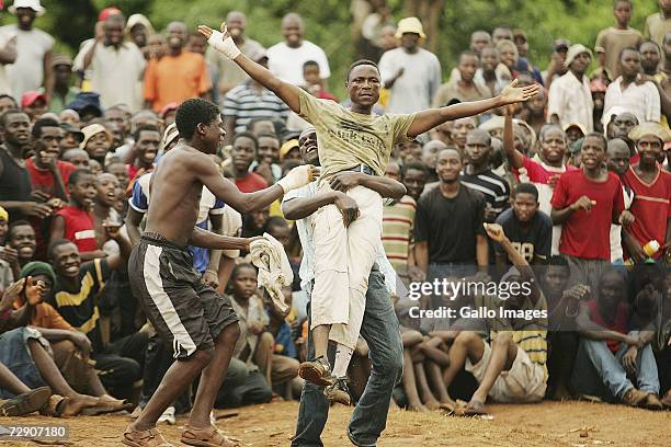 Mashudu Botswana Negwenani celebrates after a traditional fist fighting match on December 29, 2006 in Tshaulu Village, Venda, South Africa. Venda's...