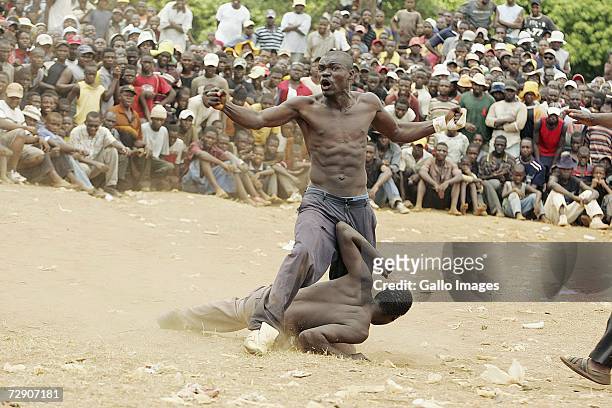 Mr T celebrates after winning against Kenny Rabulana during a traditional fist fighting match on December 29, 2006 in Tshaulu Village, Venda, South...
