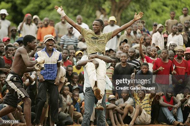 Mashudu Botswana Negwenani celebrates after a traditional fist fighting match on December 29, 2006 in Tshaulu Village, Venda, South Africa. Venda's...