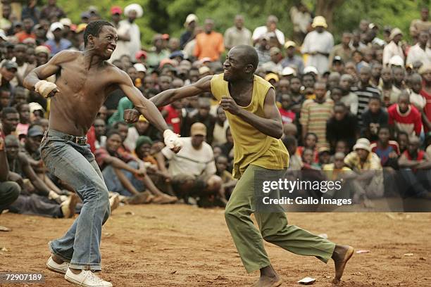 Mamanyulla Rudzani and Vincent Madzhuta fight during a traditional fist fighting match on December 29, 2006 in Tshaulu Village, Venda, South Africa....