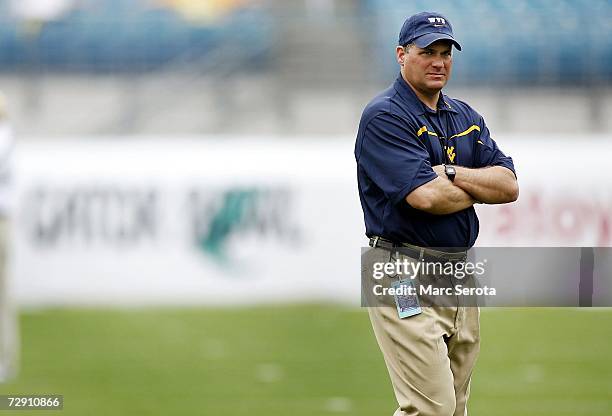 Head coach Rich Rodriguez of the West Virginia Mountaineers walks the sidelines prior to taking on the Georgia Tech Yellow Jackets in the Toyota...