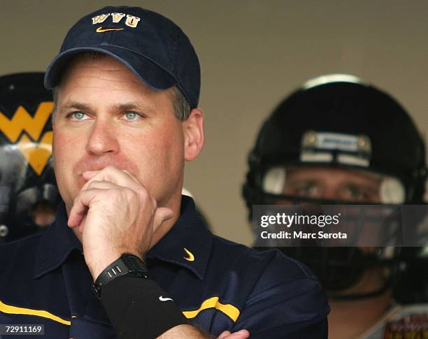 Head coach Rich Rodriguez of the West Virginia Mountaineers waits to take the field prior to taking on the Georgia Tech Yellow Jackets in the Toyota...