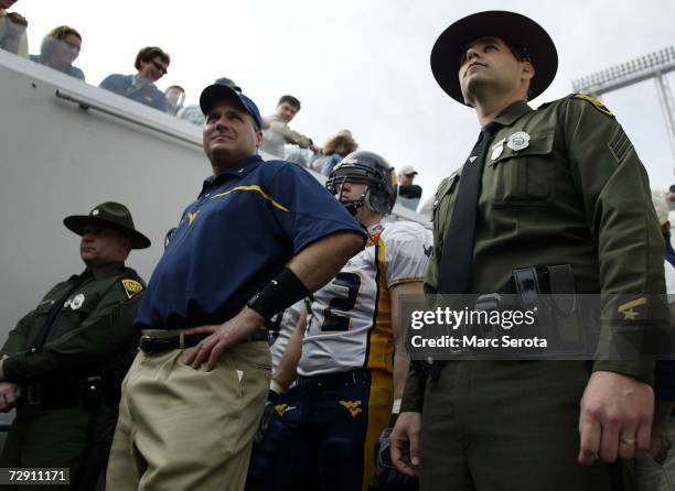 Head coach Rich Rodriguez of the West Virginia Mountaineers waits to take the field prior to taking on the Georgia Tech Yellow Jackets in the Toyota...