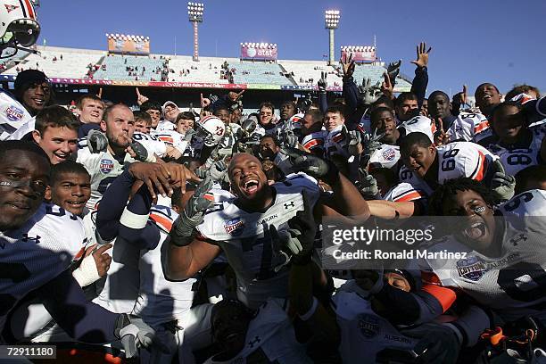 The Auburn Tigers celebrate after a 17-14 win against the Nebraska Cornhuskers during the AT&T Cotton Bowl Classic on January 1, 2007 at the Cotton...