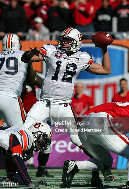 Quarterback Brandon Cox of the Auburn Tigers drops back to pass against the Nebraska Cornhuskers during the AT&T Cotton Bowl Classic on January 1,...