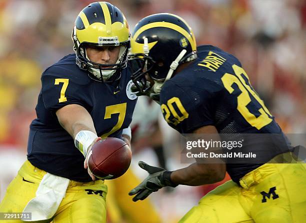 Quarterback Chad Henne of the Michigan Wolverines passes to Mike Hart during the first half of the game against the USC Trojans on January 1, 2007 at...