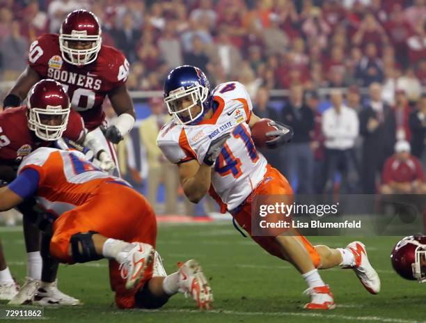 Running back Ian Johnson of the Boise State Broncos runs the football in the first quarter against the Oklahoma Sooners at the Tostito's Fiesta Bowl...