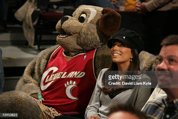 Actress Eva Longoria of ABC-TV's "Desperate Housewives" watches the game with Cleveland Cavaliers mascot MoonDog during NBA action against the San...