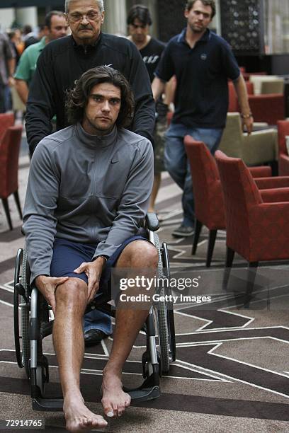 Mark Philippoussis of Australia is wheeled from a press conference at the Burswood Intercontinental Hotel on January 3, 2007 in Perth, Australia....