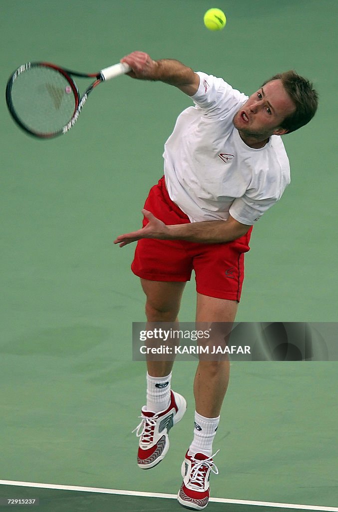 Oliver Rouch Olivier Rochus of Belgium returns the ball to Britain's Andy Murray ...