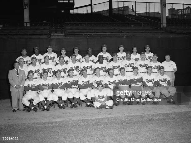 Members of the Brooklyn Dodgers pose for a team portrait in 1954 at Ebbets Field in Brooklyn, New York. George "Shotgun" Shuba, Tommy Lasorda, Harold...