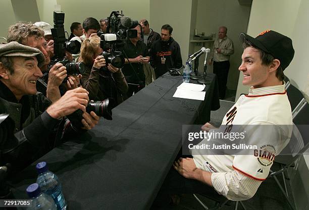 New San Francisco Giants starting pitcher Barry Zito jokes with photographers after a press conference formally announcing him to the team January 3,...